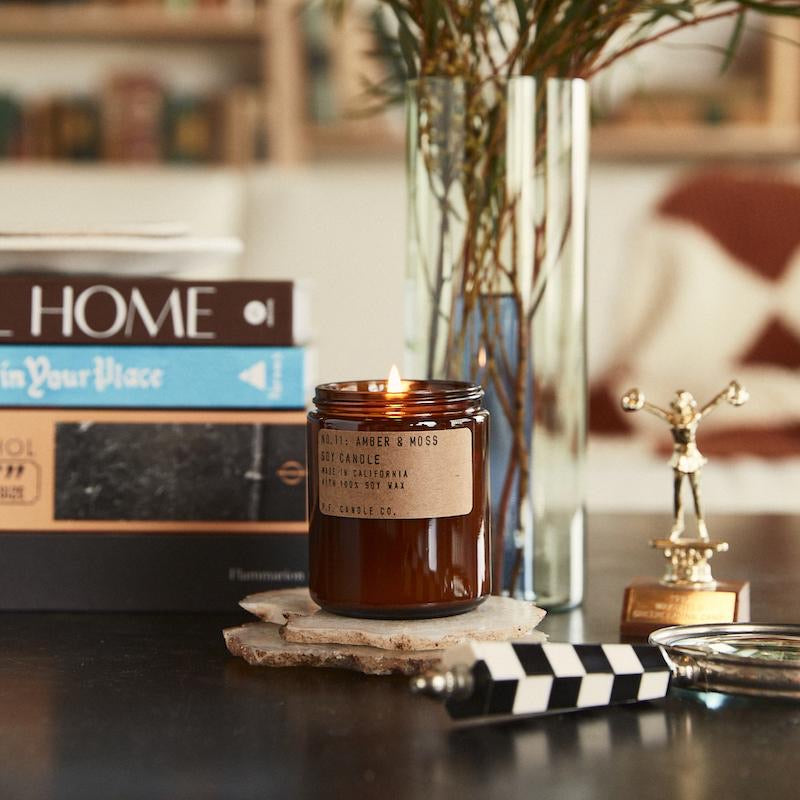 pf candle co amber moss candle front view in situ on table