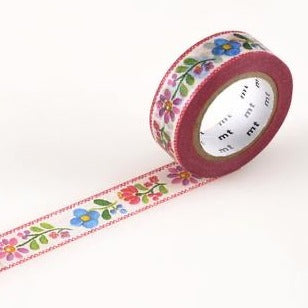 washi tape rolled out embroidery pattern on white background top view