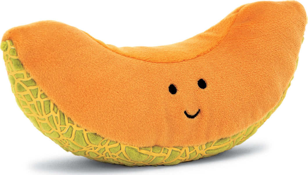 stuffed animal shaped like a slice of cantaloupe with a smiley face, photographed against a white backdrop