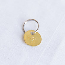 Load image into Gallery viewer, front view brass fuck it keychain from los angeles
